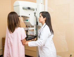 Woman getting mammogram