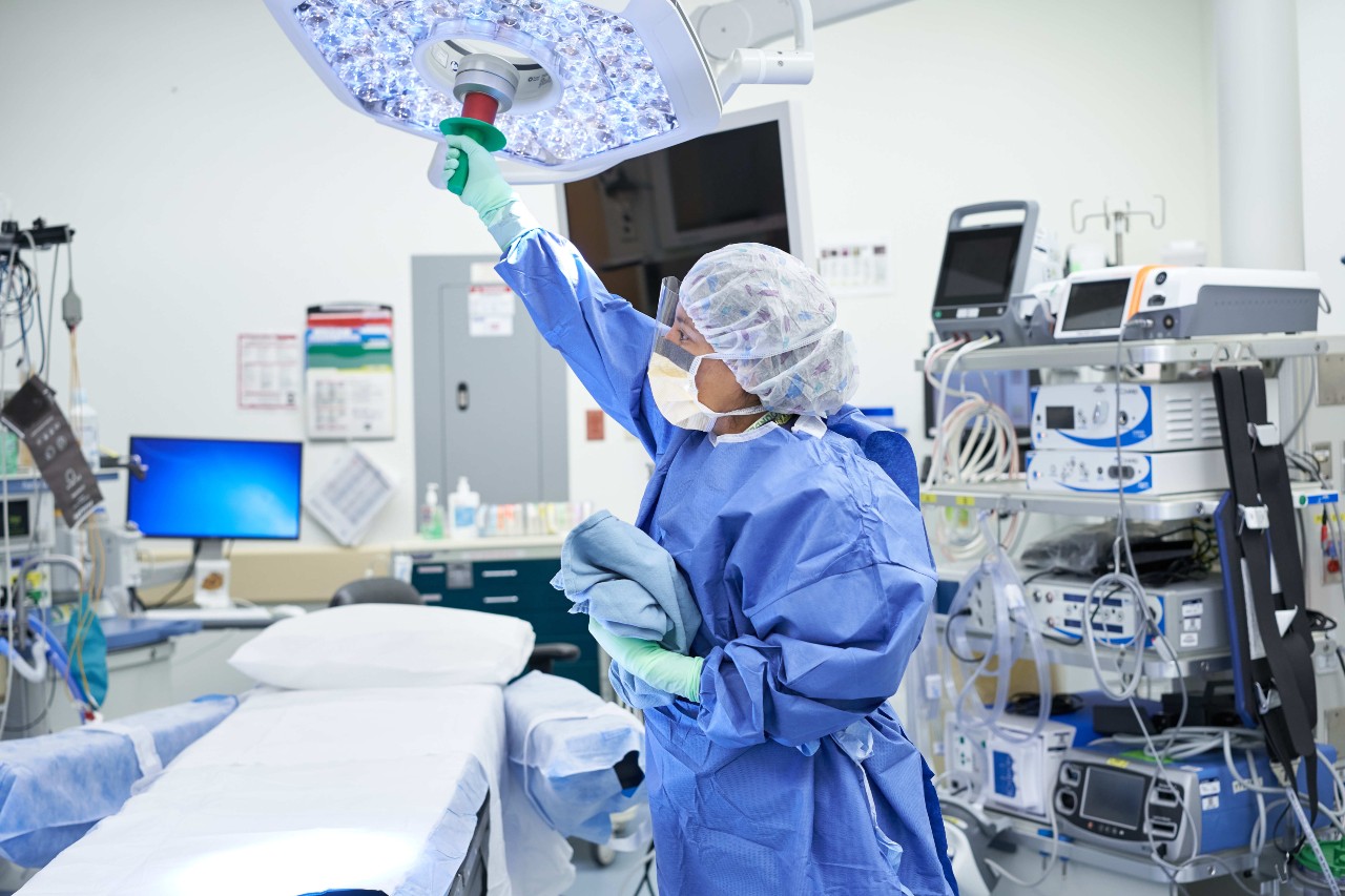 Medical professional prepares room for surgery